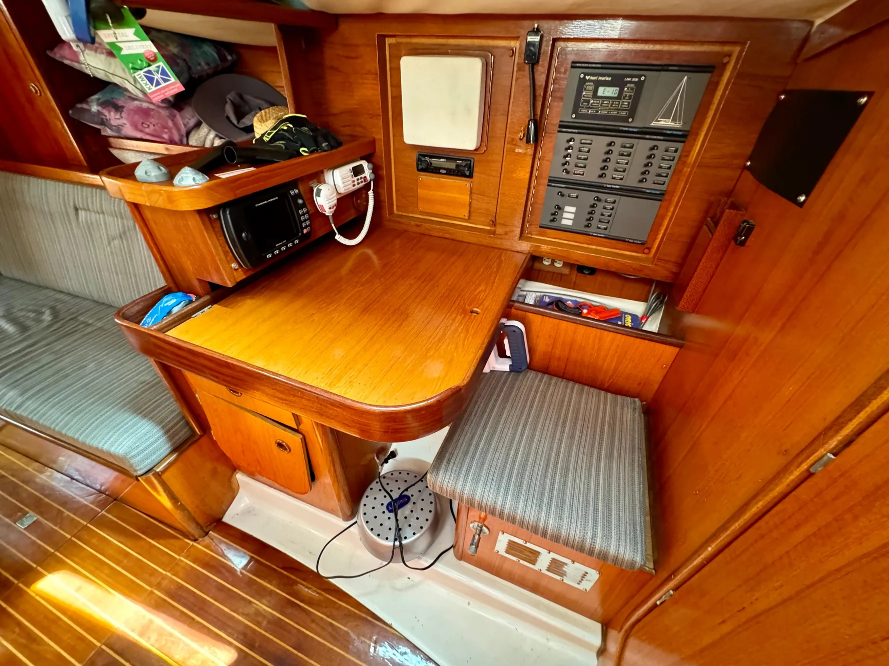 1988 Beneteau First Class 12 yacht interior with navigation station and seating area.