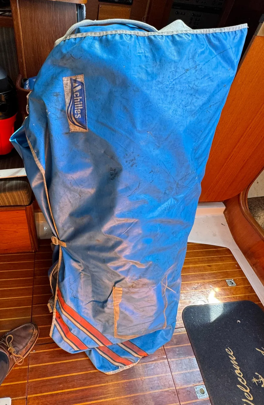 Blue sail bag on Beneteau First Class 12 yacht, 1988 model, wooden interior.