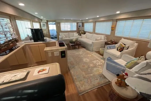 Moor River Yacht Photos Pics Luxurious interior of a 1997 Hatteras 70 Sport Deck Motor Yacht with elegant furnishings.