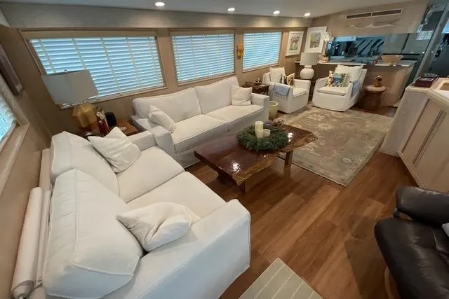 Moor River Yacht Photos Pics Luxurious interior of 1997 Hatteras 70 Sport Deck Motor Yacht with elegant white sofas.