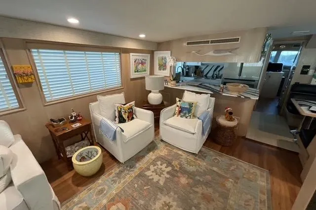 Moor River Yacht Photos Pics Luxurious interior of a 1997 Hatteras 70 Sport Deck Motor Yacht with elegant seating and decor.