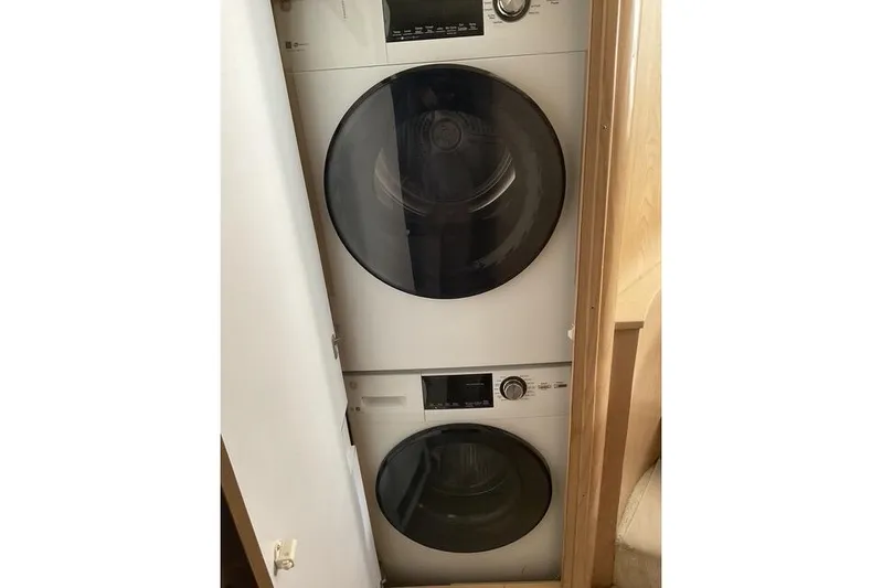 Moor River Yacht Photos Pics Stacked washer and dryer inside 1997 Hatteras 70 Sport Deck Motor Yacht.