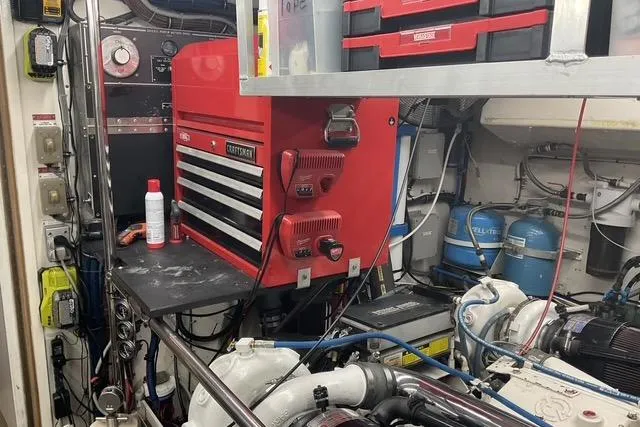 Moor River Yacht Photos Pics Engine room of 1997 Hatteras 70 Sport Deck Motor Yacht with tools and equipment.