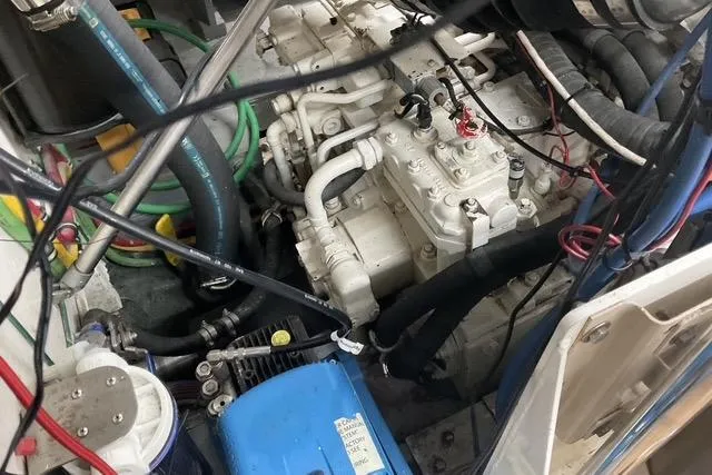 Moor River Yacht Photos Pics Engine room of 1997 Hatteras 70 Sport Deck Motor Yacht with visible machinery and wiring.