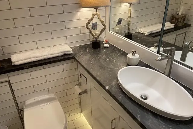 Moor River Yacht Photos Pics Luxurious bathroom in 1997 Hatteras 70 Sport Deck Motor Yacht with modern sink and elegant decor.