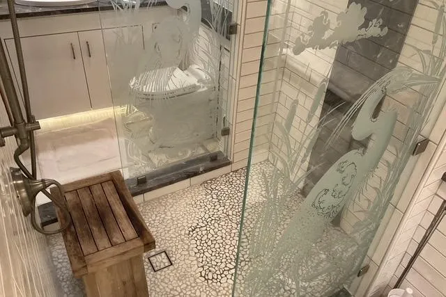 Moor River Yacht Photos Pics Luxurious bathroom on 1997 Hatteras 70 Sport Deck Motor Yacht with etched glass and wooden accents.