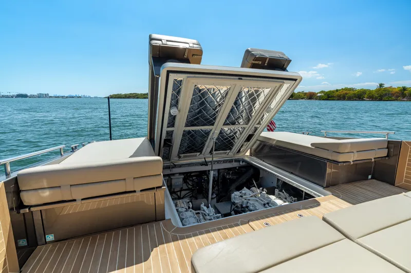 Yours Yacht Photos Pics Open engine compartment of 2016 CNM Continental Tender yacht on water.