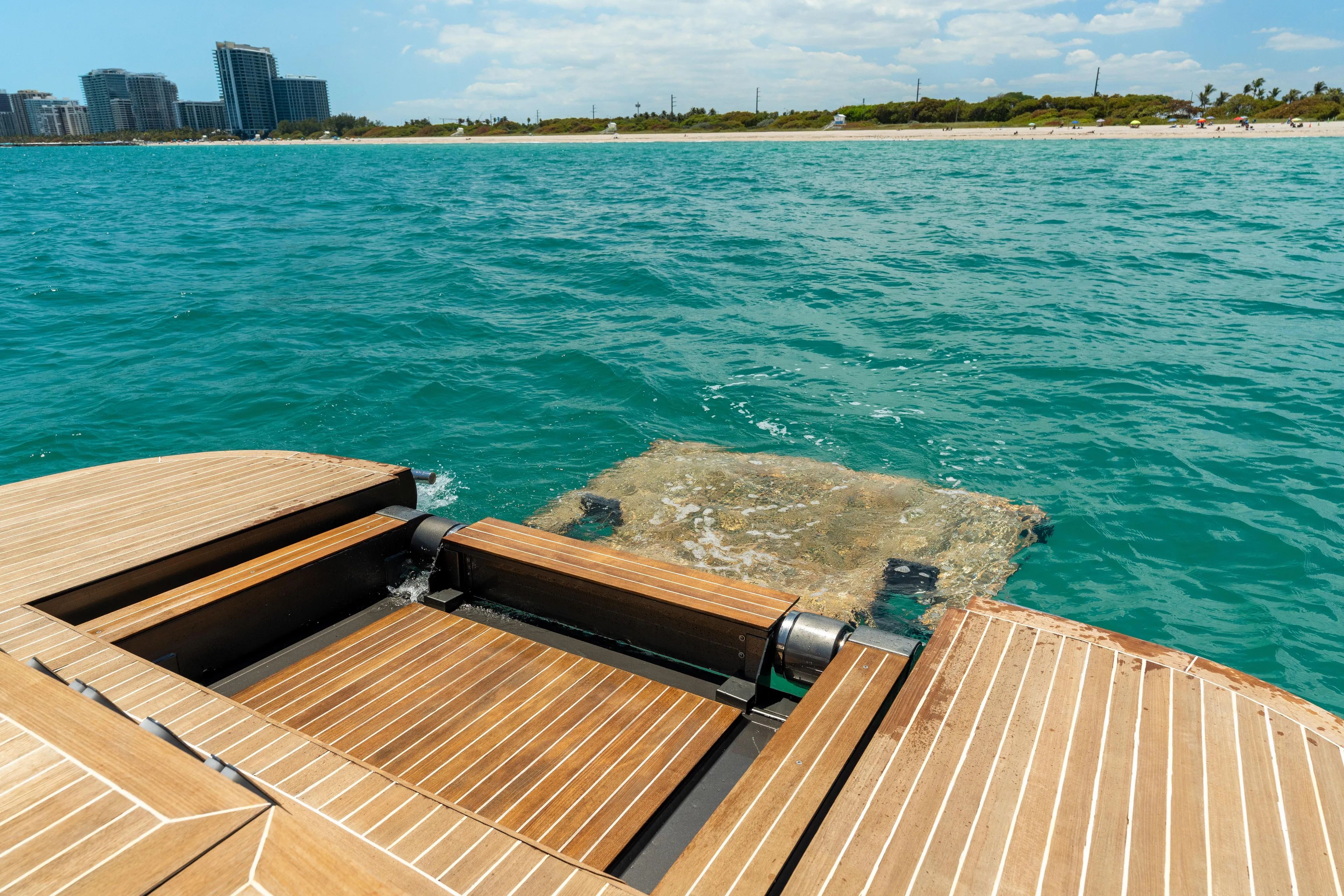 Yours Yacht Photos Pics Luxury CNM Continental Tender 2016 yacht on turquoise water near a sandy beach.