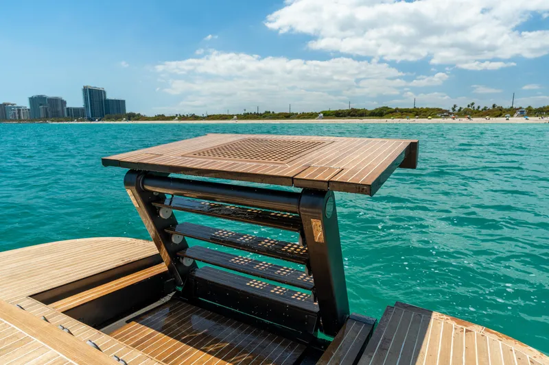 Yours Yacht Photos Pics Luxury yacht CNM Continental Tender 2016 with retractable swim platform on turquoise water.