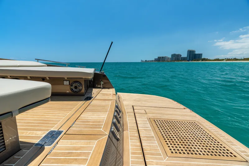 Yours Yacht Photos Pics Luxury CNM Continental Tender 2016 yacht deck with ocean view and distant city skyline.