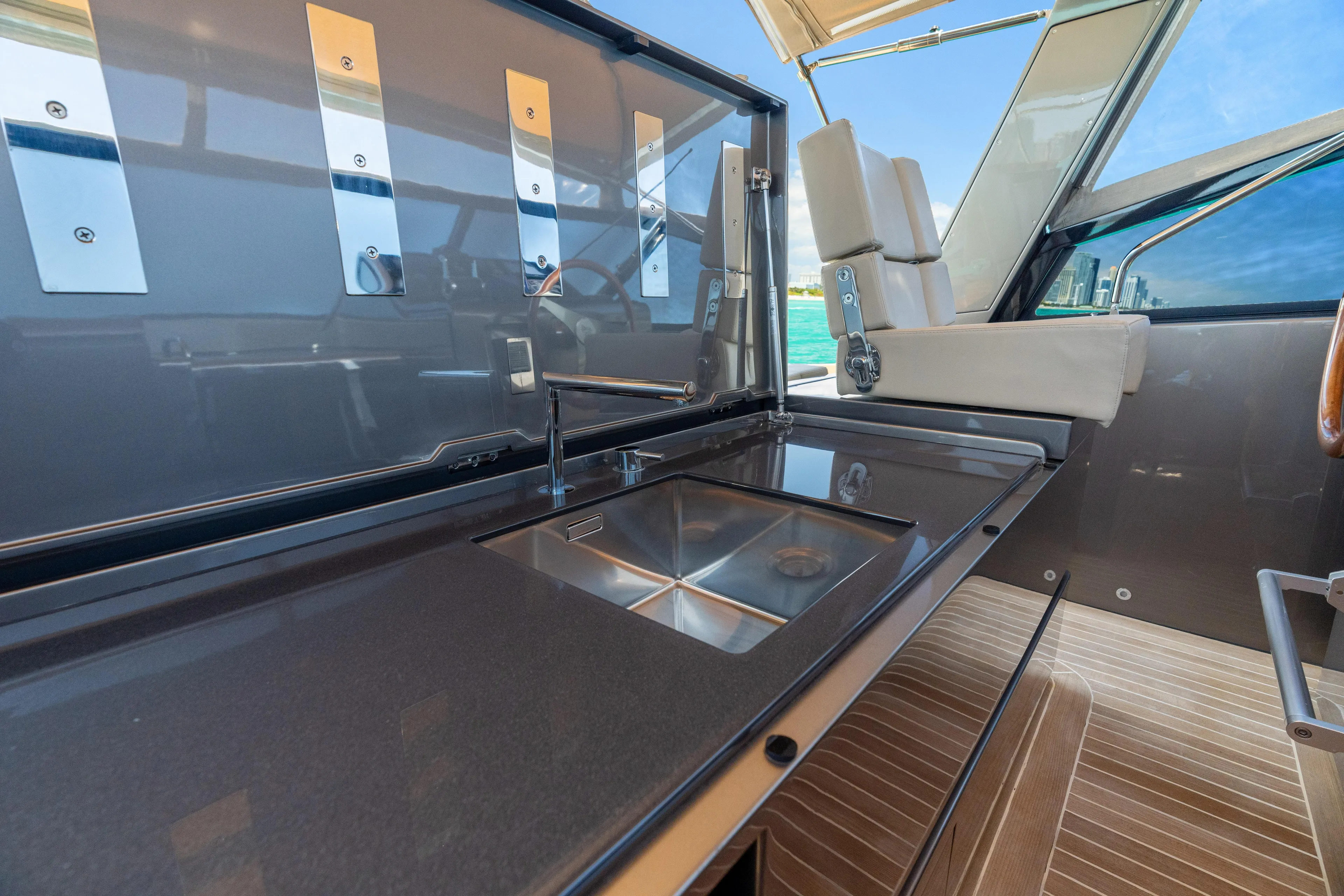 Yours Yacht Photos Pics Luxurious 2016 CNM Continental Tender yacht interior with sleek kitchen sink and modern design.