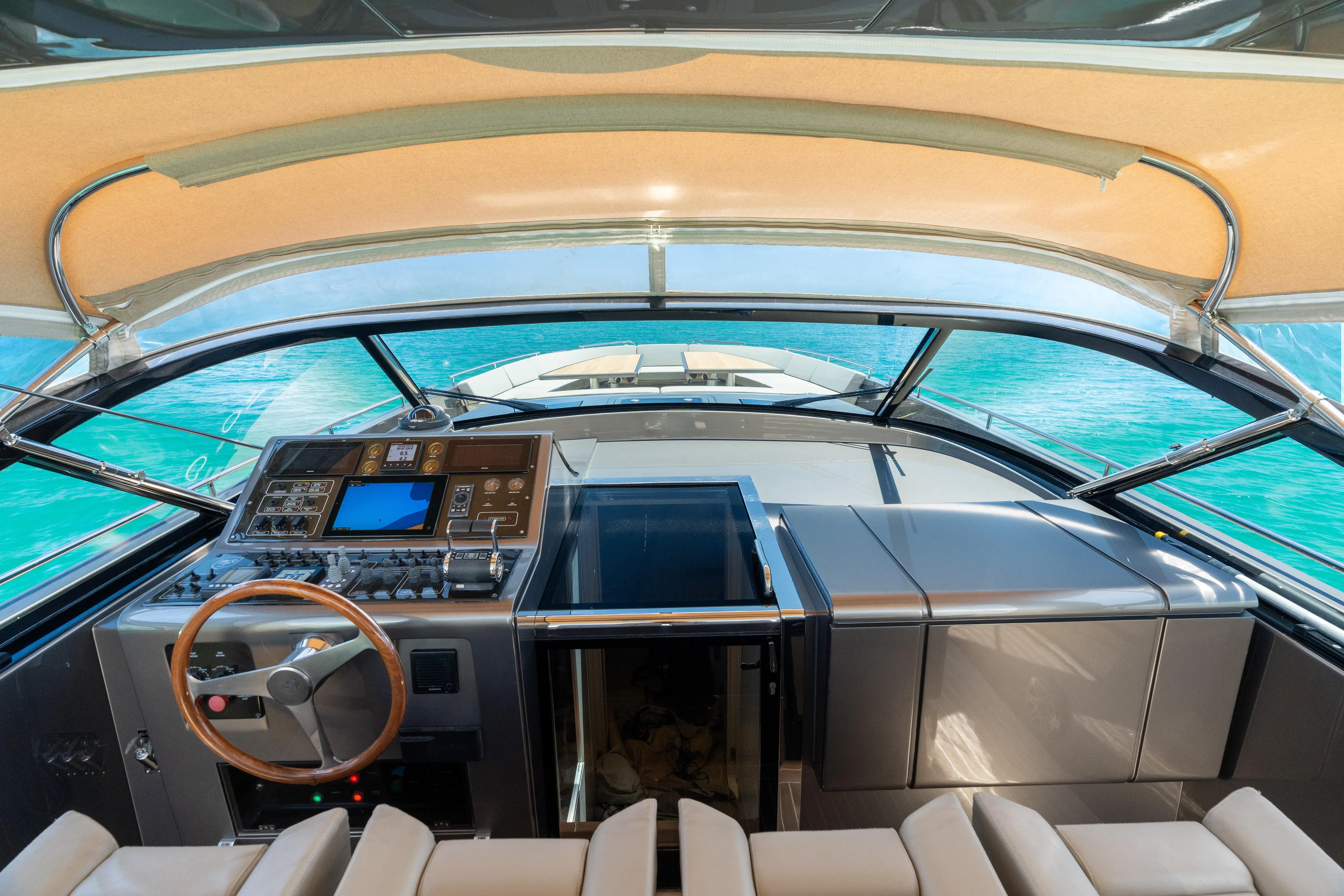 Yours Yacht Photos Pics Interior view of 2016 CNM Continental Tender yacht cockpit with modern controls and ocean backdrop.