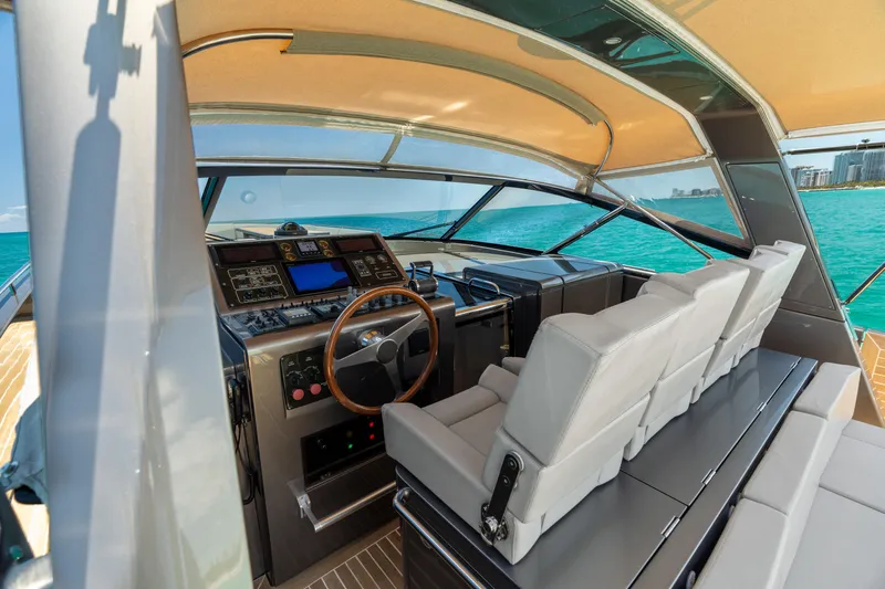 Yours Yacht Photos Pics Interior view of 2016 CNM Continental Tender yacht cockpit with modern controls and seating.