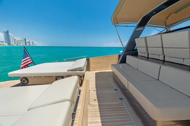 Yours Yacht Photos Pics Luxurious 2016 CNM Continental Tender yacht with spacious seating, ocean view, and city skyline.