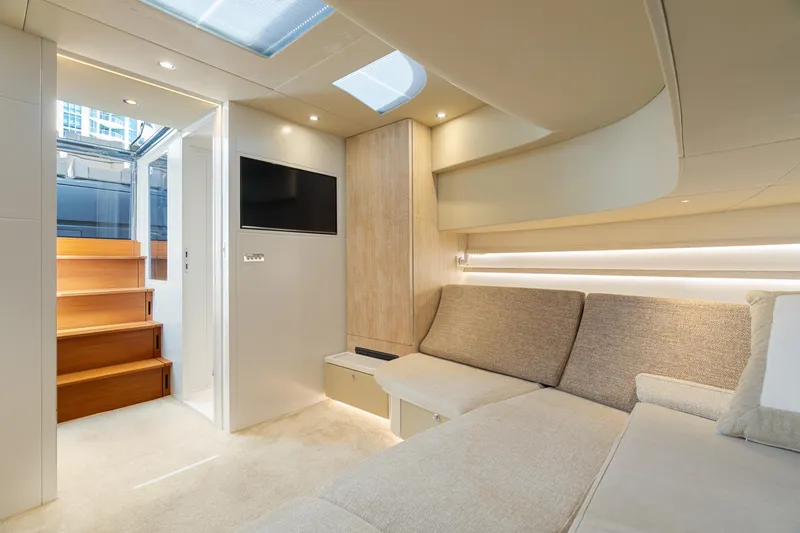 Yours Yacht Photos Pics Luxurious interior of 2016 CNM Continental Tender yacht with modern seating and natural lighting.