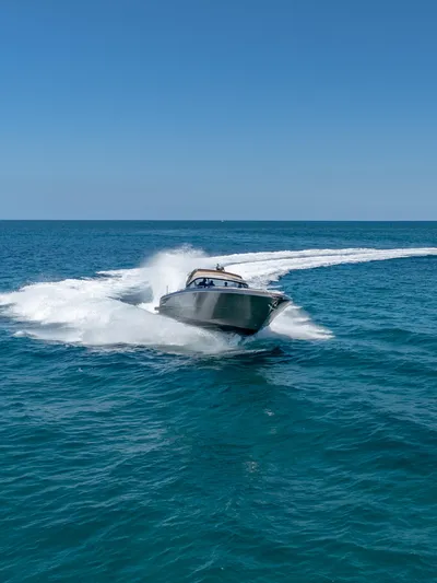 Yours Yacht Photos Pics 2016 CNM Continental Tender speeding on open sea under clear blue sky.