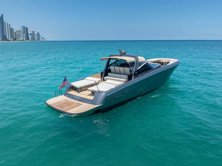 Yours Yacht Photos Pics Luxury CNM Continental Tender 2016 yacht cruising in clear blue ocean near city skyline.