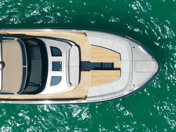 Yours Yacht Photos Pics Aerial view of 2016 CNM Continental Tender yacht on turquoise water.