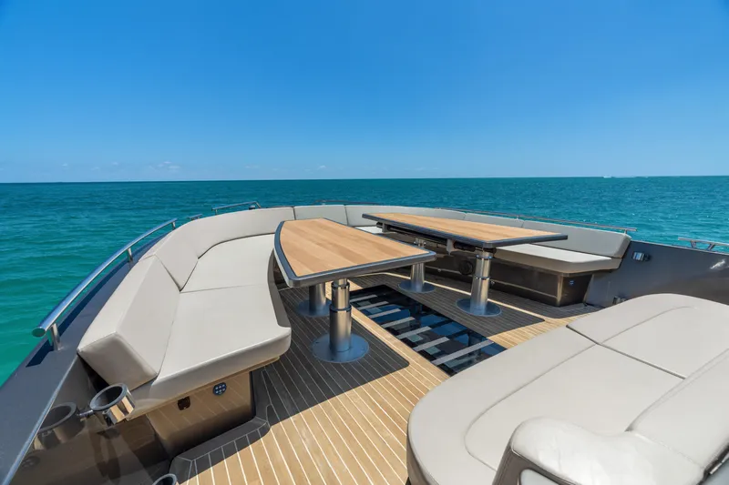 Yours Yacht Photos Pics Luxurious 2016 CNM Continental Tender yacht with elegant seating and tables on open sea.