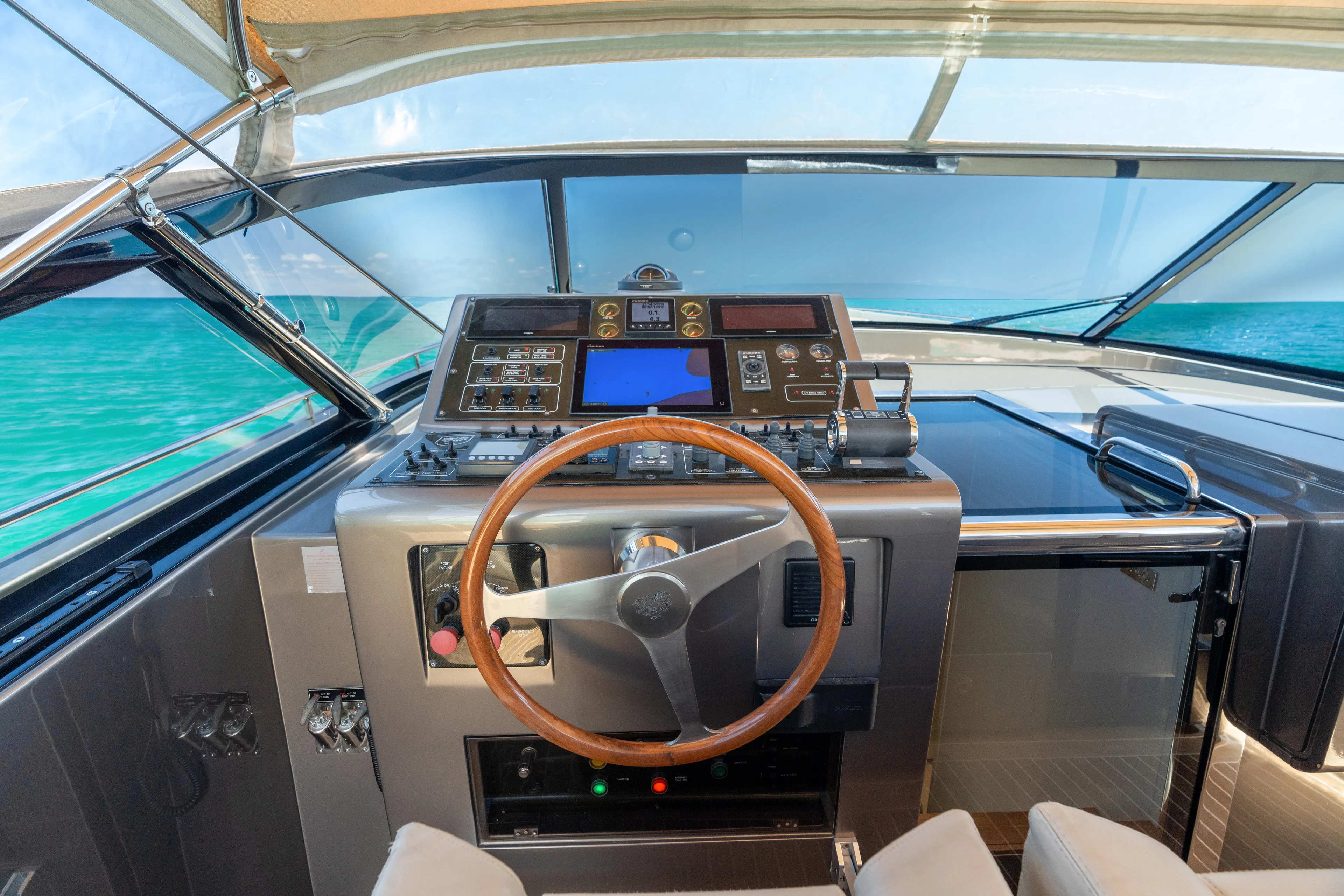 Yours Yacht Photos Pics Helm of 2016 CNM Continental Tender yacht with modern navigation controls and ocean view.