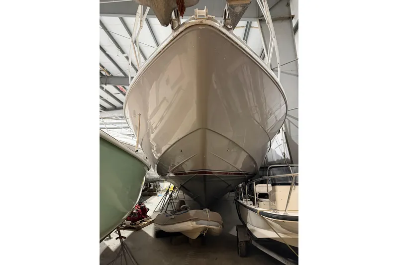  Yacht Photos Pics 1994 Ferretti Yachts 185 Fly in storage, viewed from below, showcasing sleek hull design.