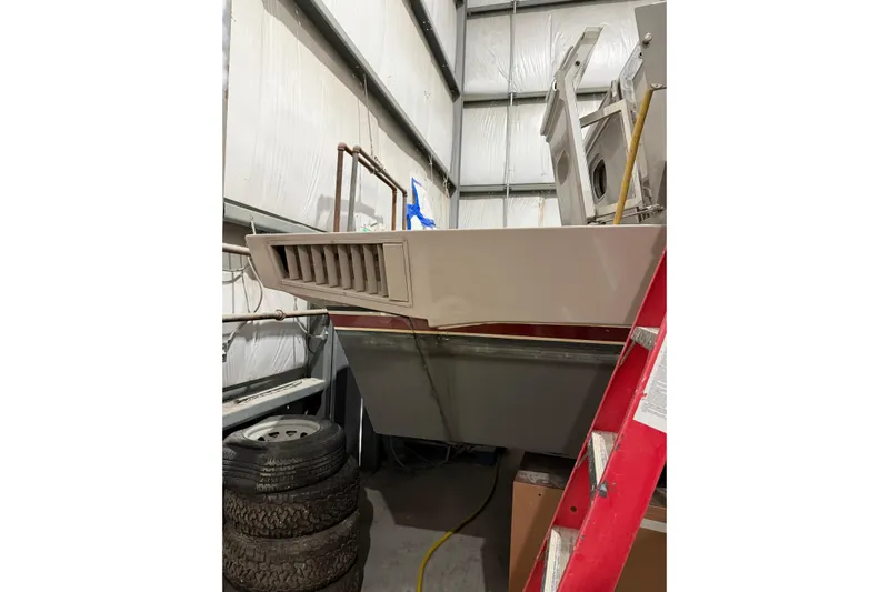  Yacht Photos Pics 1994 Ferretti Yachts 185 Fly in storage, showing rear view with ladder and tires.