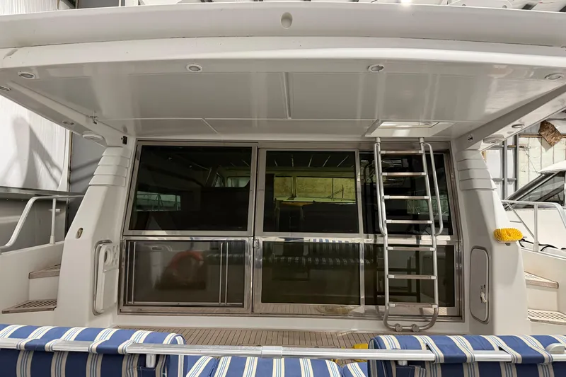  Yacht Photos Pics 1994 Ferretti Yachts 185 Fly, rear view with ladder and striped seating.