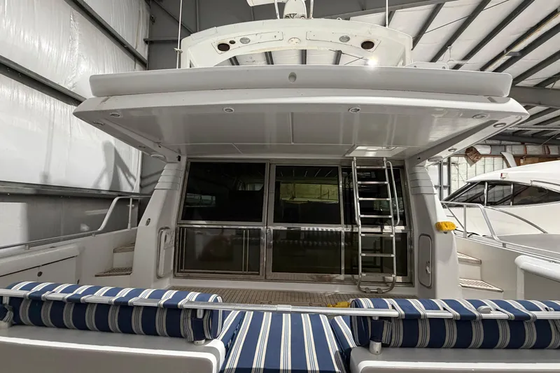  Yacht Photos Pics 1994 Ferretti Yachts 185 Fly in a storage facility, showcasing rear deck and seating.