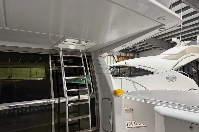  Yacht Photos Pics 1994 Ferretti Yachts 185 Fly in a marina, showcasing sleek design and modern features.