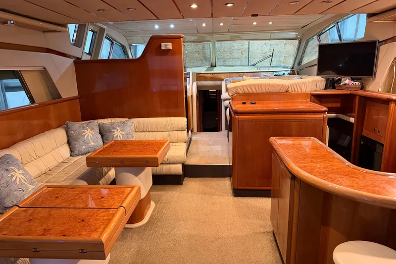  Yacht Photos Pics Luxurious interior of 1994 Ferretti Yachts 185 Fly with elegant wood finishes and plush seating.