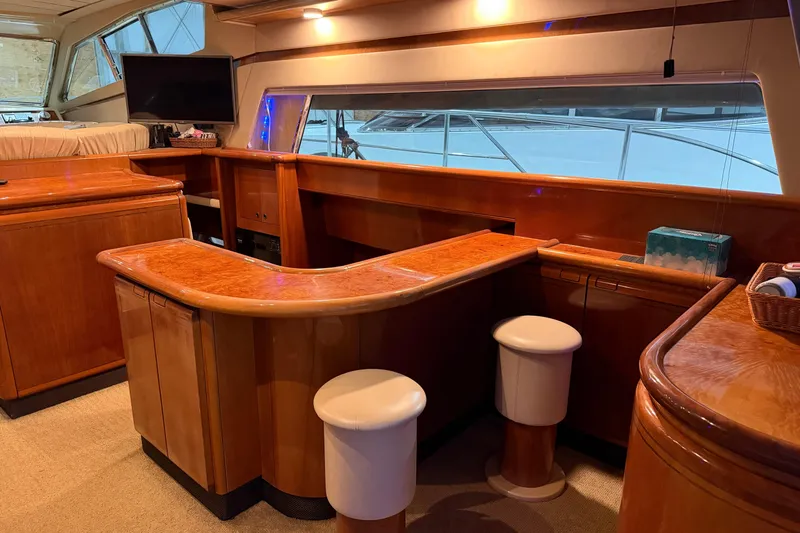  Yacht Photos Pics Luxurious interior of 1994 Ferretti Yachts 185 Fly with elegant wood finishes and seating.