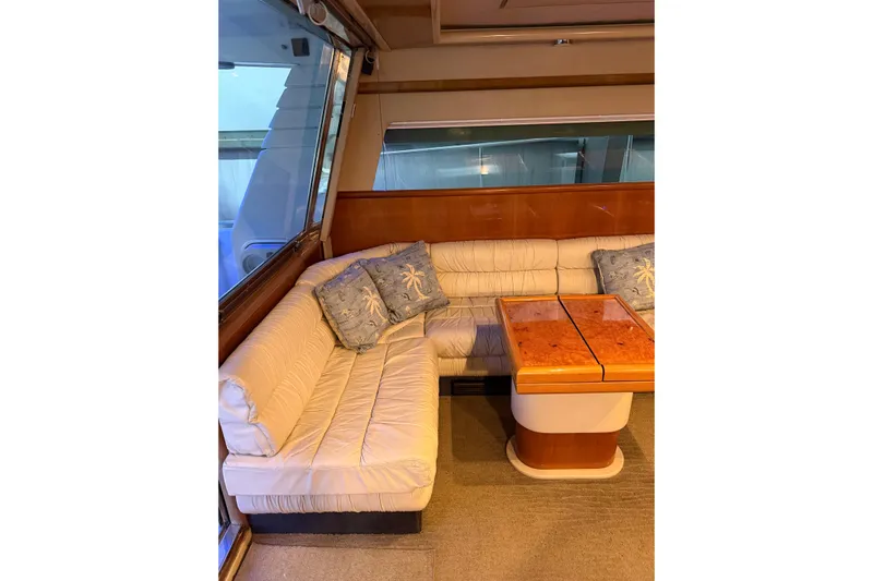  Yacht Photos Pics Luxurious interior of 1994 Ferretti Yachts 185 Fly with plush seating and elegant table.