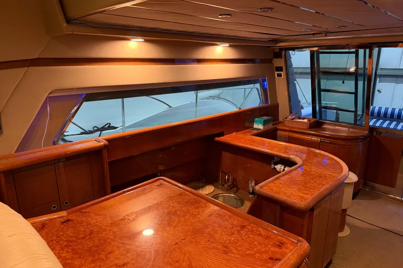  Yacht Photos Pics Luxurious interior of a 1994 Ferretti Yachts 185 Fly with elegant wood finishes.