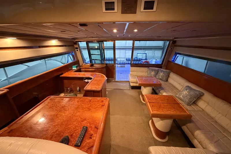  Yacht Photos Pics Luxurious interior of 1994 Ferretti Yachts 185 Fly with elegant wood finishes and plush seating.