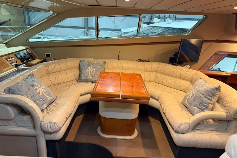  Yacht Photos Pics Luxurious interior of 1994 Ferretti Yachts 185 Fly with plush seating and elegant decor.
