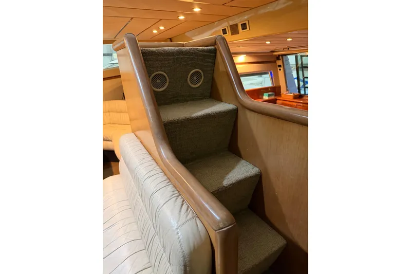  Yacht Photos Pics Interior stairs of 1994 Ferretti Yachts 185 Fly, featuring carpeted steps and wooden handrails.