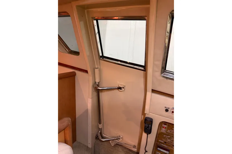  Yacht Photos Pics Interior view of 1994 Ferretti Yachts 185 Fly, featuring a window and control panel.