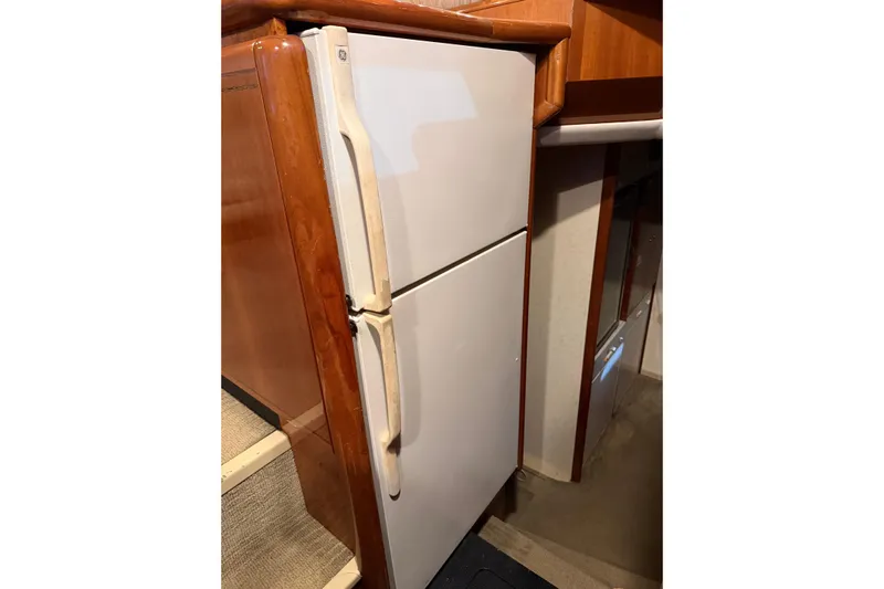  Yacht Photos Pics Refrigerator inside 1994 Ferretti Yachts 185 Fly, wooden cabinetry detail.