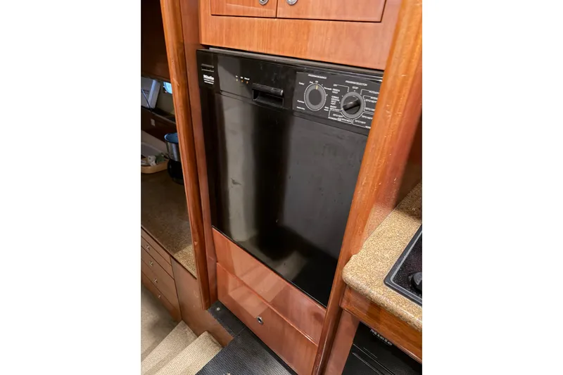  Yacht Photos Pics Miele dishwasher in 1994 Ferretti Yachts 185 Fly kitchen area.