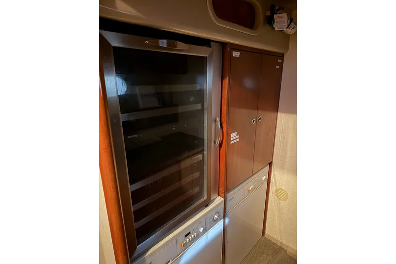  Yacht Photos Pics Interior of 1994 Ferretti Yachts 185 Fly, featuring a sleek kitchen cabinet setup.