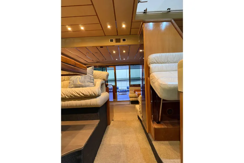  Yacht Photos Pics Luxurious interior of 1994 Ferretti Yachts 185 Fly with plush seating and elegant design.