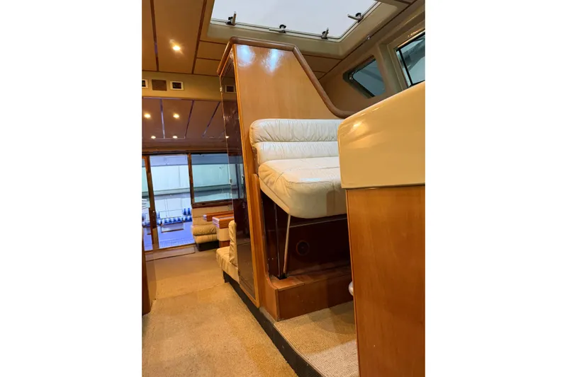  Yacht Photos Pics Interior of 1994 Ferretti Yachts 185 Fly, featuring elegant wood and plush seating.