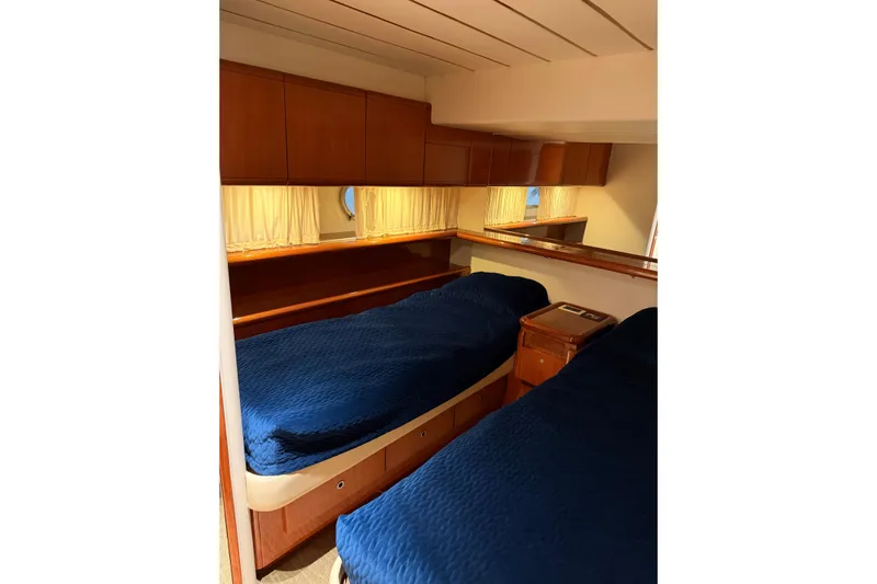  Yacht Photos Pics Luxurious cabin interior of 1994 Ferretti Yachts 185 Fly with twin beds.
