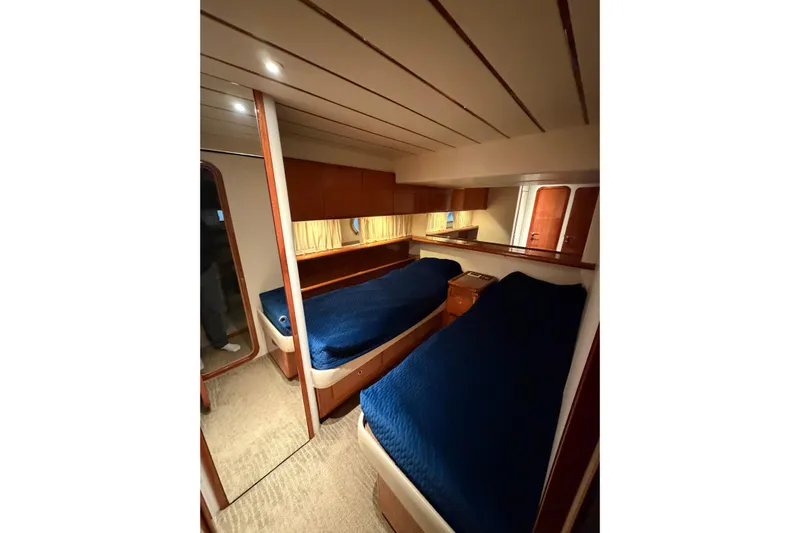  Yacht Photos Pics 1994 Ferretti Yachts 185 Fly cabin with twin beds and wooden interior.