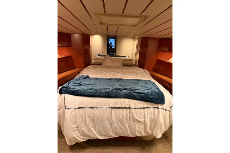 Yacht Photos Pics Luxurious bedroom interior of 1994 Ferretti Yachts 185 Fly with cozy bedding.