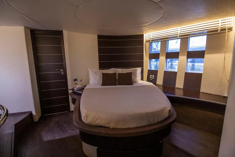 Sofierì Yacht Photos Pics Luxurious bedroom interior of 2005 Azimut 68S yacht with modern design and ambient lighting.