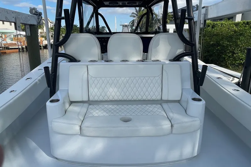  Yacht Photos Pics 2023 Conch 41 Center Console boat with white seating and cup holders.