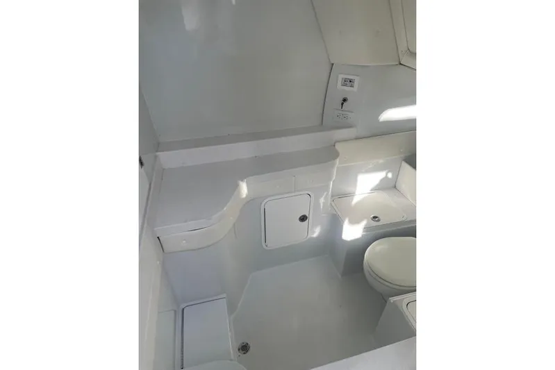  Yacht Photos Pics 2023 Conch 41 Center Console boat interior with modern white bathroom amenities.