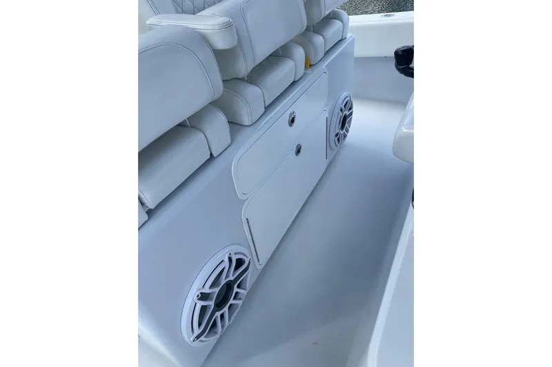  Yacht Photos Pics 2023 Conch 41 Center Console interior with white seating and built-in speakers.