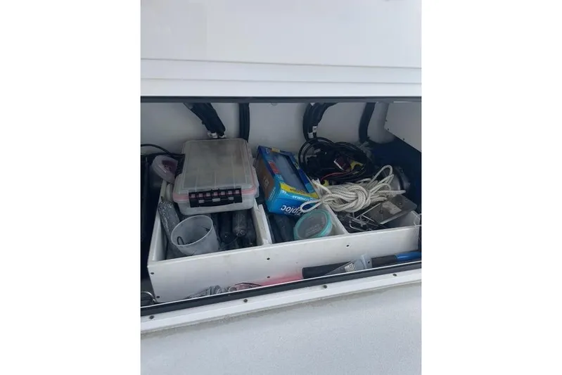  Yacht Photos Pics Storage compartment of 2023 Conch 41 Center Console with various boating supplies.
